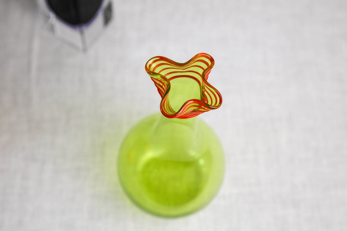 Delightful vintage citron green and red glass vase