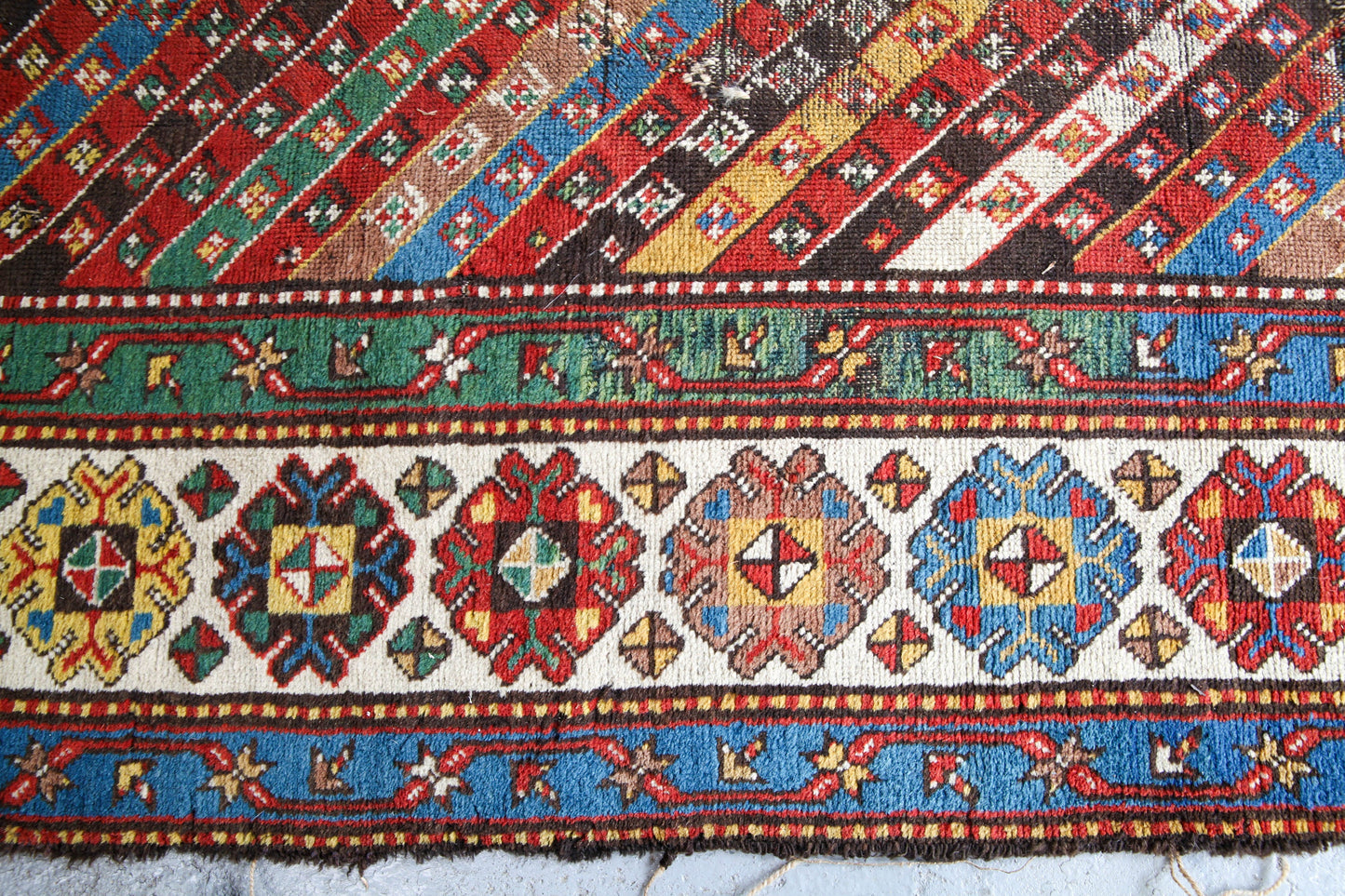 Antique, evocative late 19th century Genje Caucasian carpet / hallway runner in blue, red, green and yellow