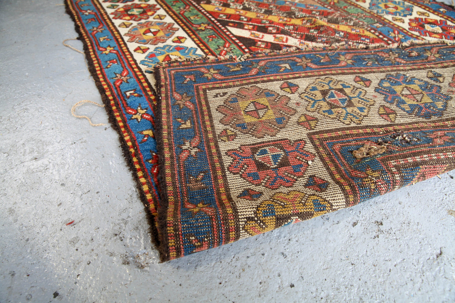 Antique, evocative late 19th century Genje Caucasian carpet / hallway runner in blue, red, green and yellow