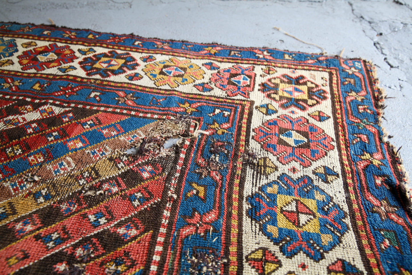 Antique, evocative late 19th century Genje Caucasian carpet / hallway runner in blue, red, green and yellow