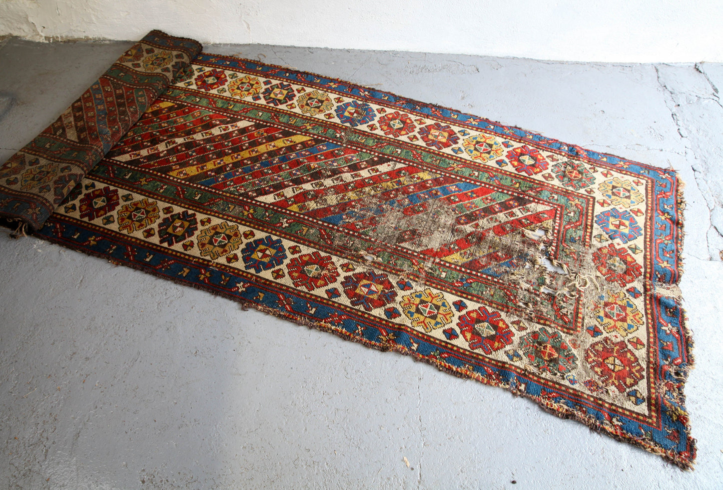 Antique, evocative late 19th century Genje Caucasian carpet / hallway runner in blue, red, green and yellow