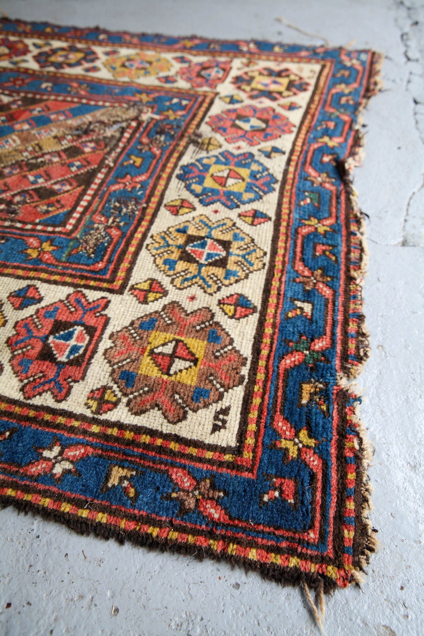 Antique, evocative late 19th century Genje Caucasian carpet / hallway runner in blue, red, green and yellow