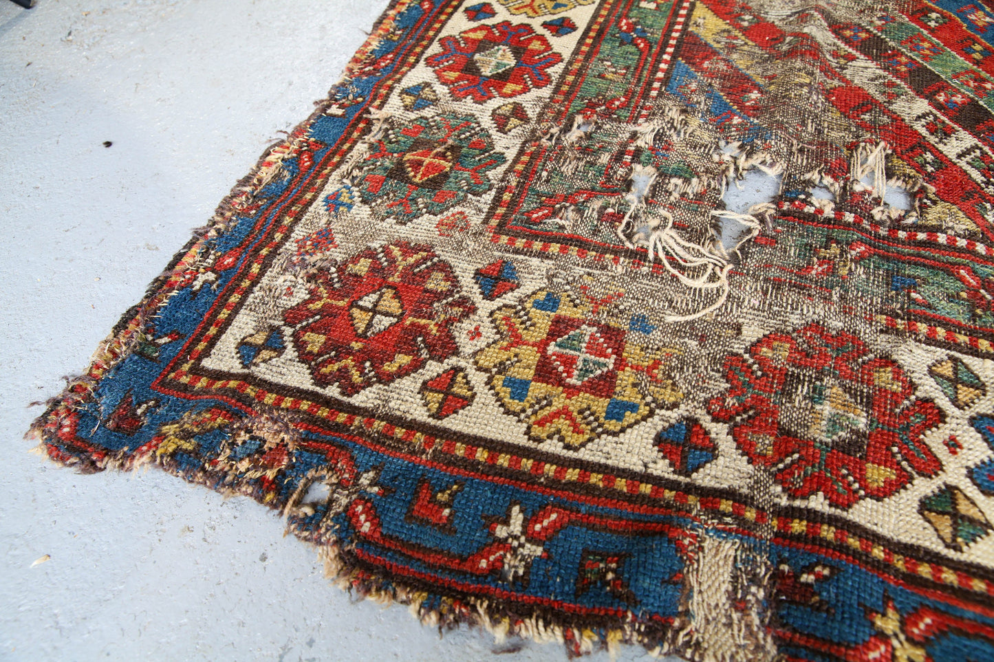 Antique, evocative late 19th century Genje Caucasian carpet / hallway runner in blue, red, green and yellow
